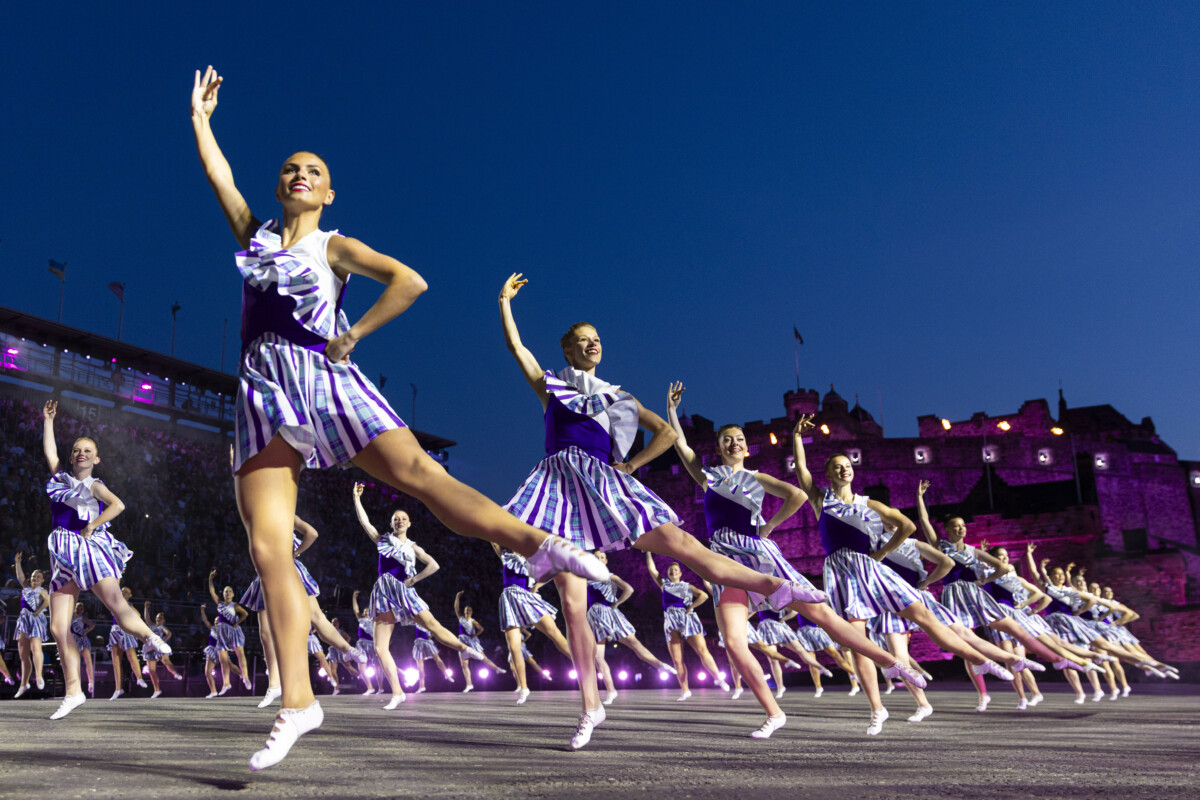 Rows of dancers performing at the Royal Edinburgh Military Tattoo.