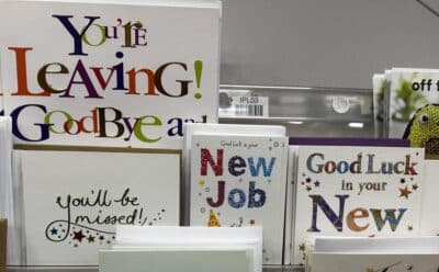 New job congratulations cards on a shop rack.