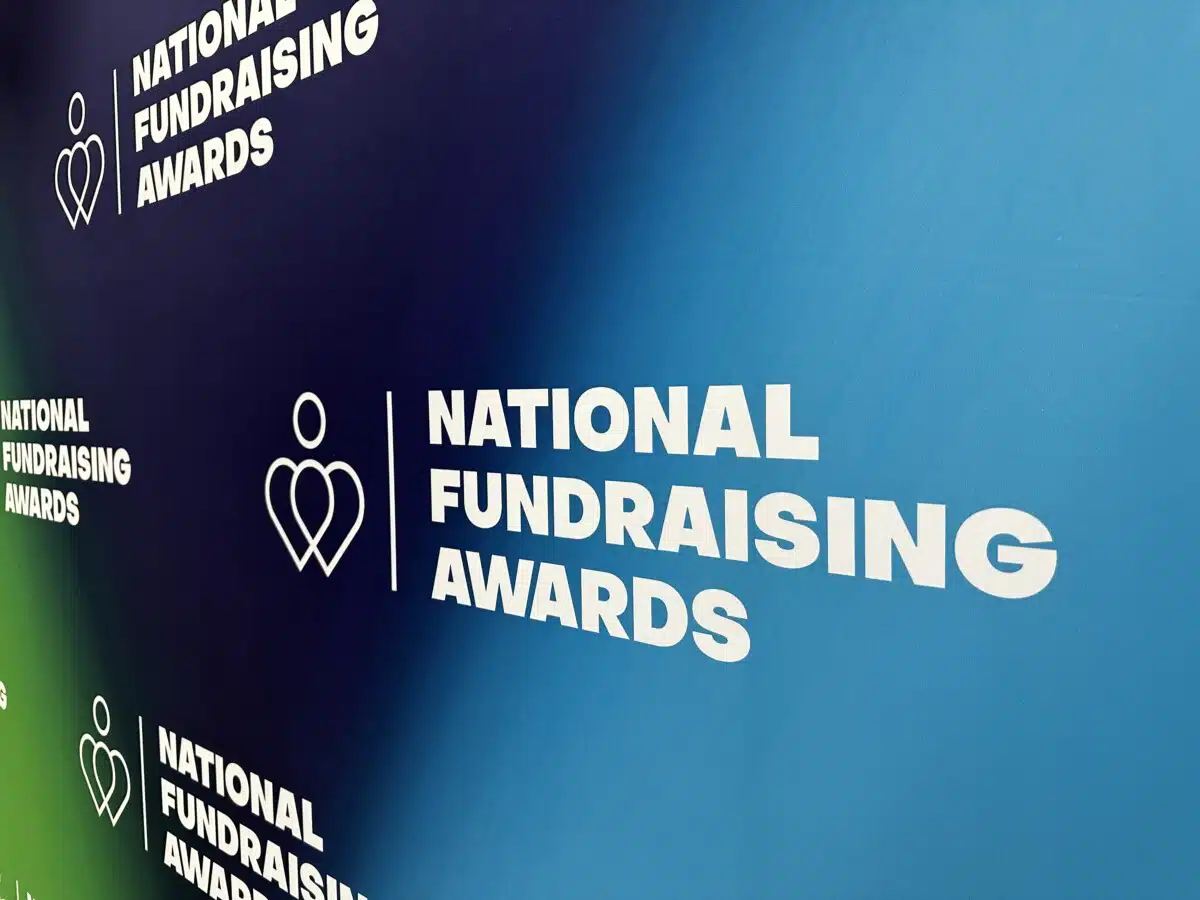 National Fundraising Awards logos on a step and repeat board
