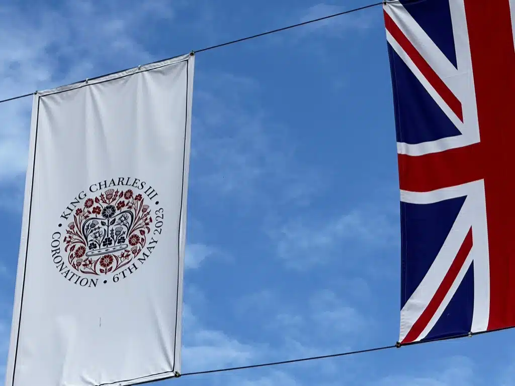 King Charles III's coronation flag and Union Flag strung across Colchester High Street.