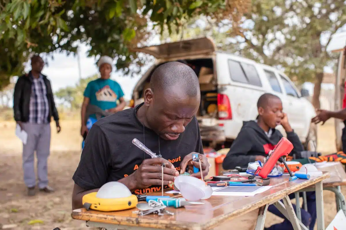 SolarAid installs the final solar home system in Kasakula, Malawi to reach 100% of the community