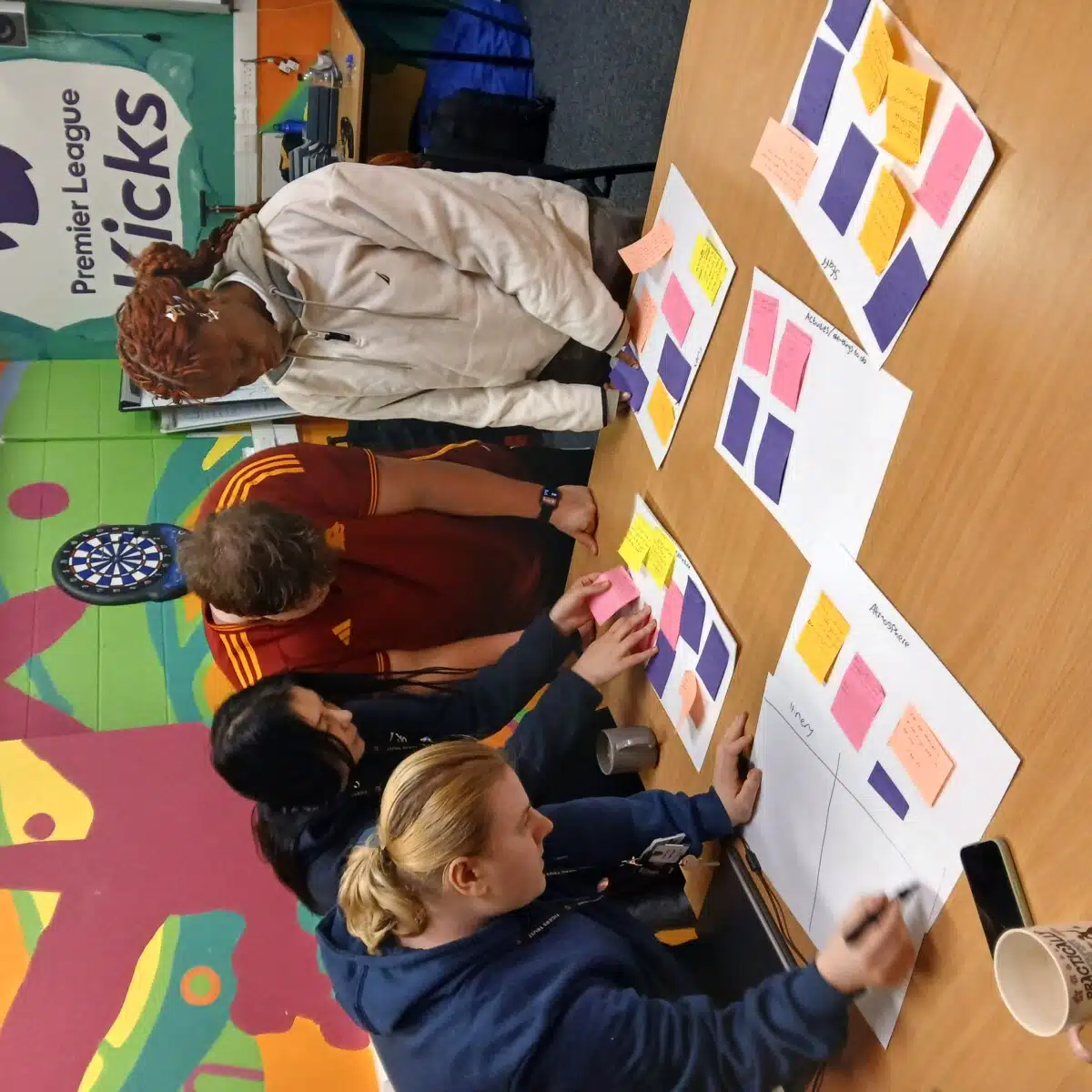 Ayomide Adeyemi working with a group as part of her research for the Peer Action Collective, previously funded through the #iwill Fund