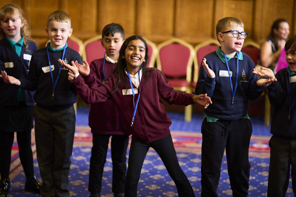 Schoolchildren take part in an event at Bradford City Hall organised by the Linking Network. Photograph: Christopher Thomond/The Guardian