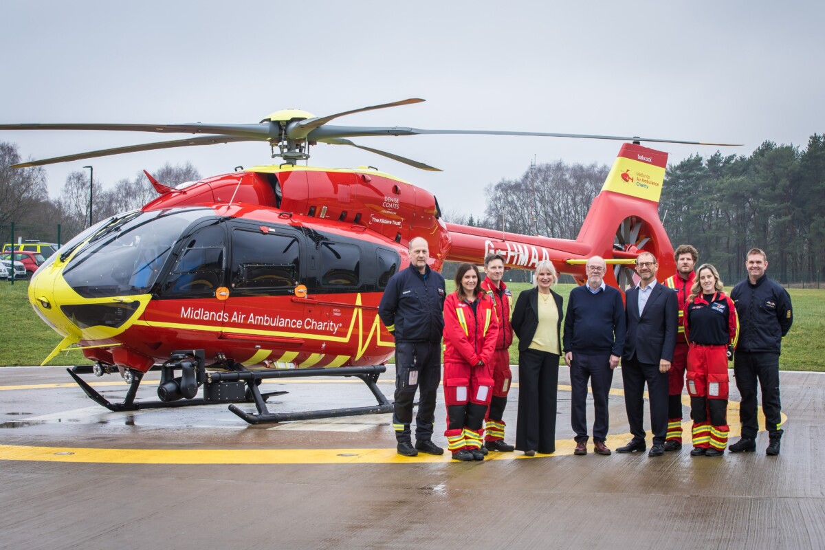 L-R: Hanna Sebright, Chief Executive; Sir David Nicholson KCB CBE, Patron; and Keith Marriott, Chairman of the board of Trustees, pictured with aircrew of Midlands Air Ambulance Charity.