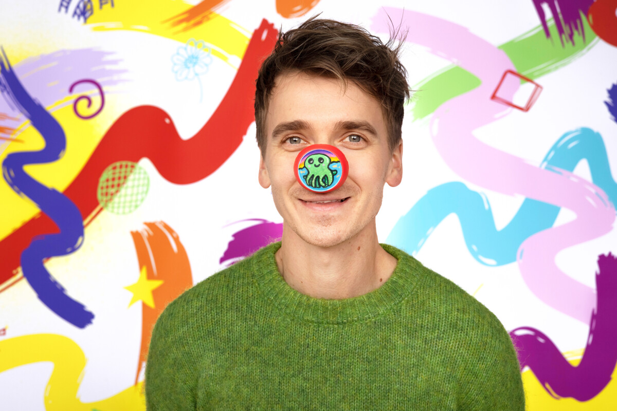 Youtuber Joe Sugg supports Red Nose Day 2026 by wearing one of the new Design-Yer Noses.