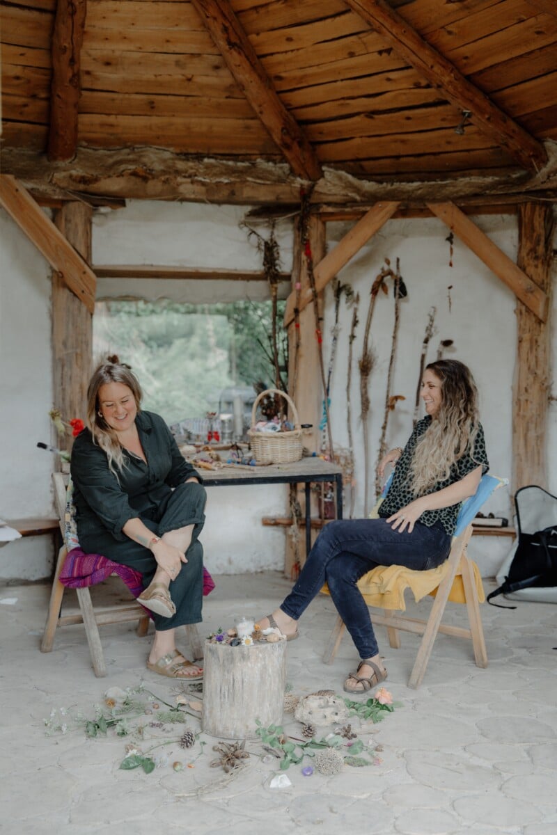 Two women talking at The Green House.