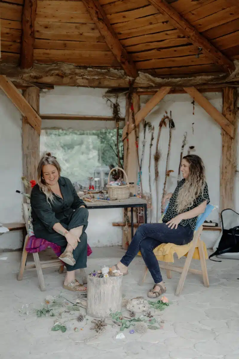 Two women talking at The Green House.