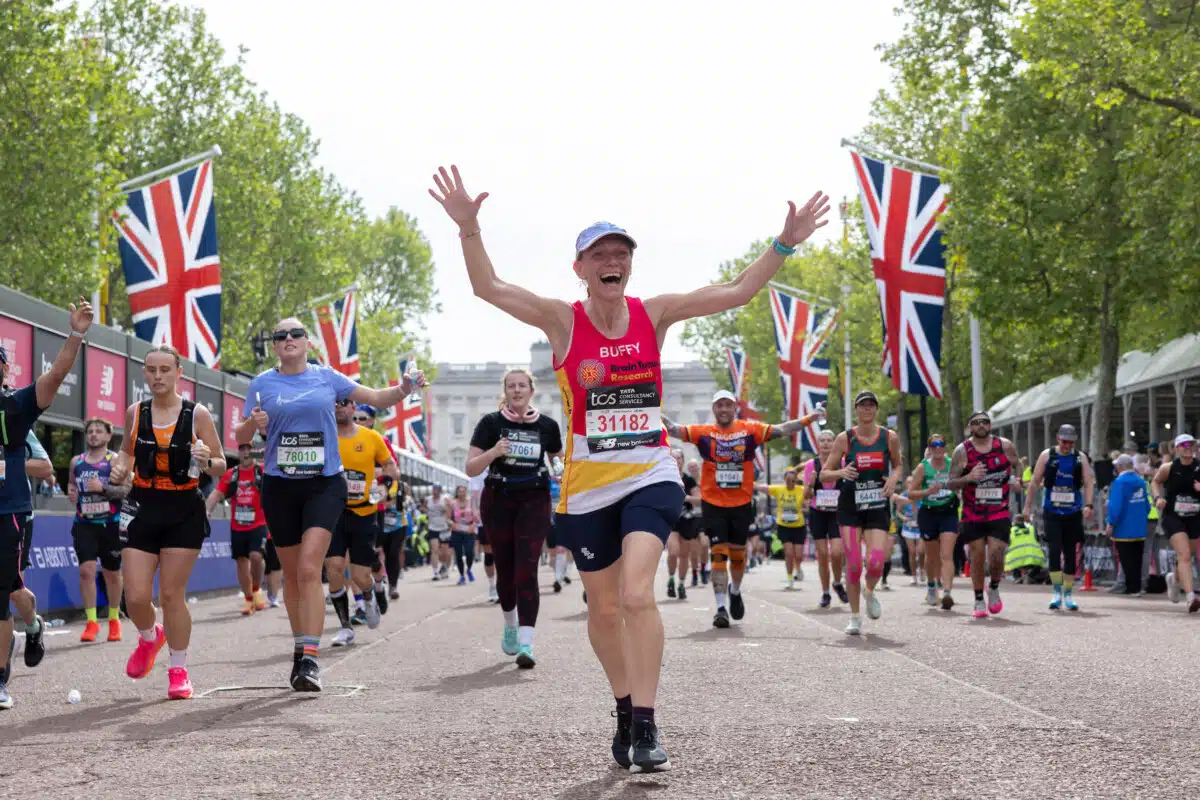 Participants react as they cross the finish line at The Mall during the TCS London Marathon on Sunday 26th April 2026.