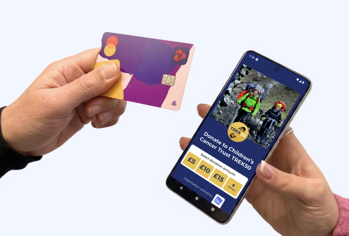 A donor taps their Mastercard card on a Give A Little mobile giving app. White blank background.